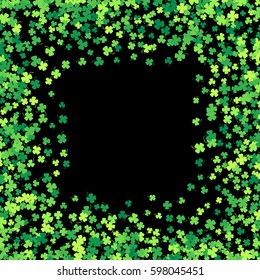 Square green frame, border or background of random scatter clover leaves with tails. Elegant St. Patricks day design for festive banner, greeting card, postcard, flyer. Vector illustration.