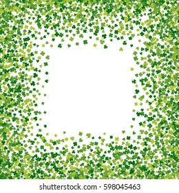 Square green frame, border or background of random scatter clover leaves with tails. Elegant St. Patricks day design for festive banner, greeting card, postcard, flyer. Vector illustration.