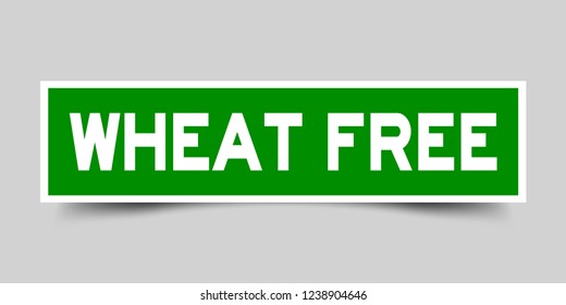 Square green sticker label in word wheat free on gray background