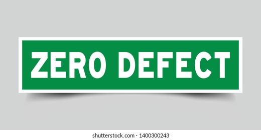 Square green sticker label in word zero defect on gray background