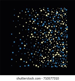 Square luminescent background of a random scatter of blue and gold circles with a glowing effect, isolated on black.