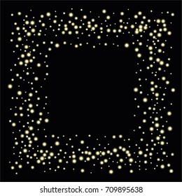 Square luminescent frame or border of a random scatter of gold circles with a glowing effect, isolated on black.