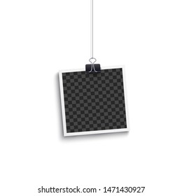 Square picture frame with white border - realistic vintage mockup isolated on white background. Retro instant photo template hanging on paperclip, 3D vector illustration