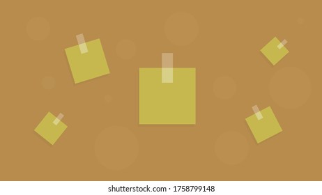 Square pieces of paper are glued with tape to the bokeh background