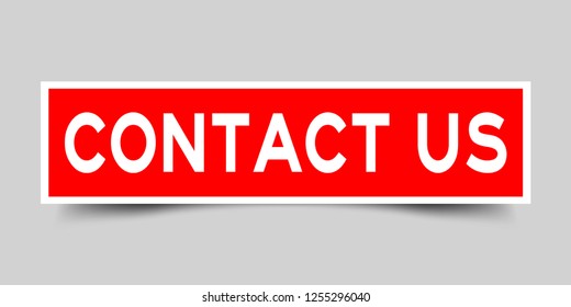 Square red color sticker with word contact us on gray background