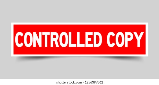 Square red color sticker with word controlled copy on gray background