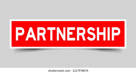 Square red sticker label in word partnership on gray background