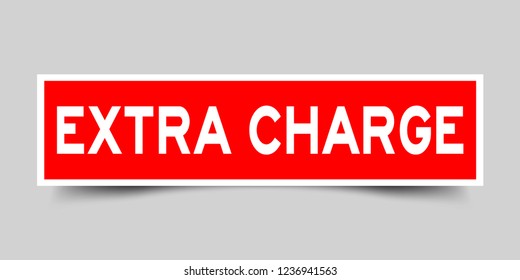 Square red sticker label in word extra charge on gray background