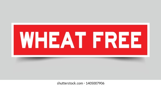 Square red sticker label in word wheat free on gray background