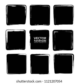 Square smears of black textured brush strokes set isolated on a white background