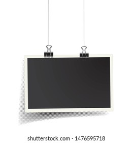 Square vector photo frame hanging on metal clips with halftone shadow. Template photo design	
