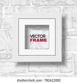 Square white picture frame with passepartout hanged on white modern brick wall