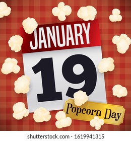 Squared tablecloth with loose-leaf calendar, some popped corn scattered around it and golden ticket to celebrate Popcorn Day this 19th January.
