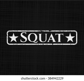 Squat chalkboard emblem on black board