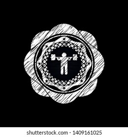squat icon inside chalk emblem written on a blackboard