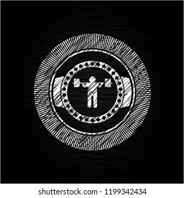 squat icon inside chalkboard emblem on black board