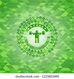 squat icon inside green emblem with triangle mosaic background