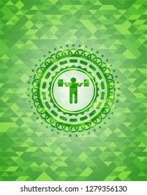 squat icon inside green emblem with triangle mosaic background