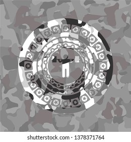 squat icon inside grey camouflage emblem