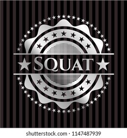 Squat silvery badge