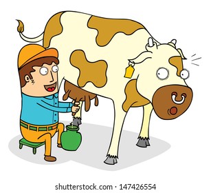 squeezing cow milk