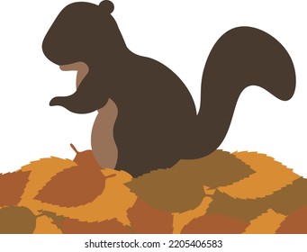 A squirrel standing on a pile of fallen leaves