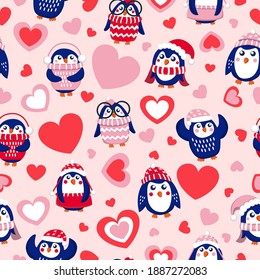 St Valentine’s day. Seamless pattern with blue baby penguins wearing pink, red and white sweaters, hats and scarfs. Pink background. Cute and funny. Wallpaper, textile, scrapbooking, wrapping paper