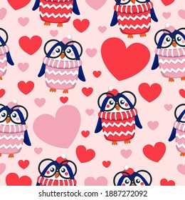 St Valentine’s Day. Seamless pattern with hearts and blue baby penguins in pink, red, white hats and sweaters. Child in glasses. Pink background. Wallpaper, textile, scrapbooking and wrapping paper