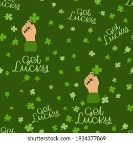 St. Patrick’s day vector seamless pattern with hand holding four leaf clover and get lucky text.