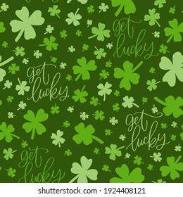 St. Patrick’s day vector seamless pattern with dark green background, shamrock and get lucky calligraphy sign.