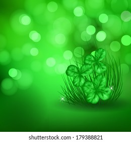 St. Patrick  day card,  fresh green grass and three clovers  on beautiful spring bokeh background
