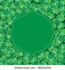St. Patrick day card. Green label with space for text on background covered with many three leaf clovers.