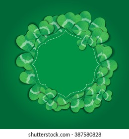 St. Patrick day card. Green label with space for text and clovers on green background.