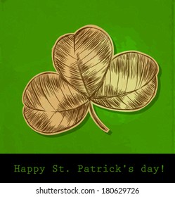  St. Patrick day card, hand- drawn three leaf clover on green background with old paper texture