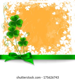 St. Patrick day card, white floral frame, green silk bow, three cloves and grunge orange background