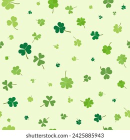 St Patrick Day irregular seamless pattern green clover leaves isolated on light green background. luck