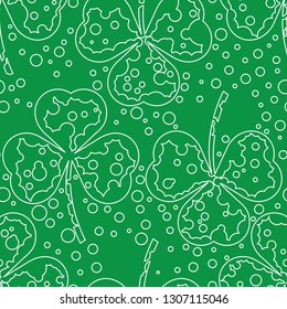 St Patrick day pattern. Seamless pattern of line art of clover leaves and dots. Two colour repeat pattern design. Vector drawing of clovers. Green endless background or textile print.