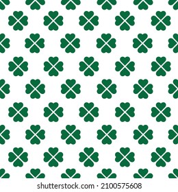 St Patrick Day. Seamless pattern with little four leaf clovers. Clover sign symbol pattern. Simple Repeatable design with Green clover on a White Background. Good luck symbol of Ireland