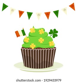St. Patrick's cupcake with shamrock clover and the flag of Ireland. Flat cartoon vector illustration isolated on a white background.