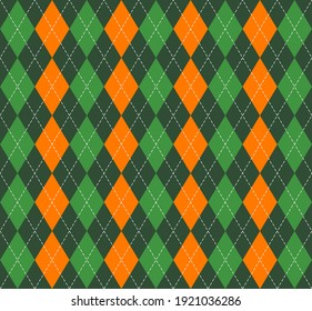 St. Patricks day Argyle plaid. Scottish pattern in green, orange and white rhombuses. Scottish cage. Traditional Scottish background of diamonds. Seamless fabric texture. Vector illustration