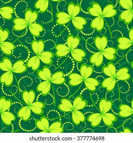 St. Patrick's day background. Clover leaves on green background. Green color seamless pattern. Vector illustration.