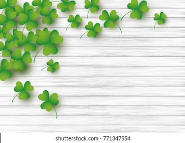 St Patrick's day background design of clover leaves on white wood with copy space vector illustration