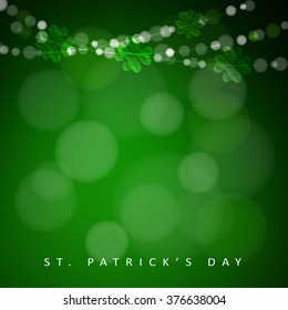 St. Patrick's day background with garland of lights and shamrocks, vector illustration