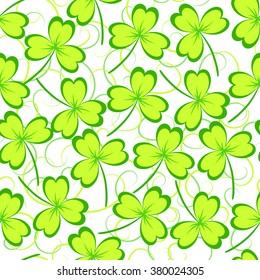 St. Patrick's day background. Green clover leaves on white background. Seamless pattern. Vector illustration.