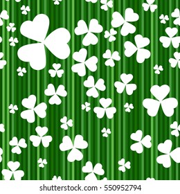 St Patrick's Day background. Seamless shamrock pattern. White shamrock leaves isolated on green abstract striped background. Vector illustration