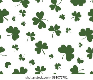 St Patrick's Day background with three leaves clover. Green on white color.The Symbol Of Ireland. The Irish pattern. Vector seamless backdrop clover, trefoil, shamrock