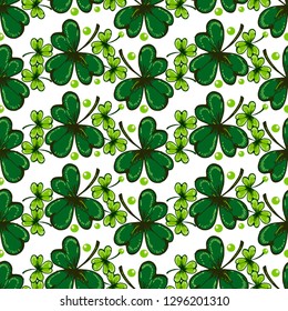 St. Patrick's Day background. Vector seamless pattern with irish symbols of St. Patrick' s holiday such as green shamrock leaves