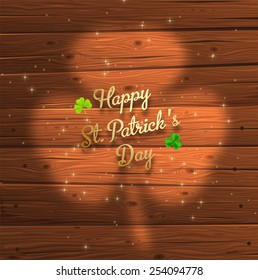 St. Patrick's Day Background with Wood Texture. Blurred Cloverleaf.