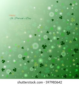 St. Patrick's day bokeh background with shamrock leaves, Light green backdrop and text for invitation or greeting card