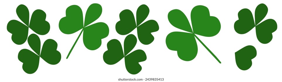 St Patricks Day bottom border of shamrocks over a white background